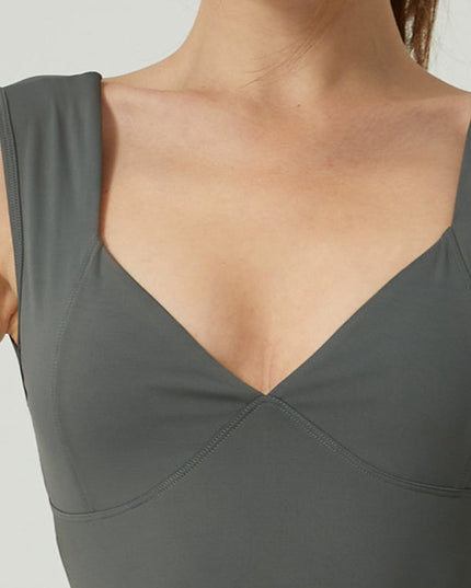 ZASUWA Female V Collar Backless Pocket Flare Jumpsuit